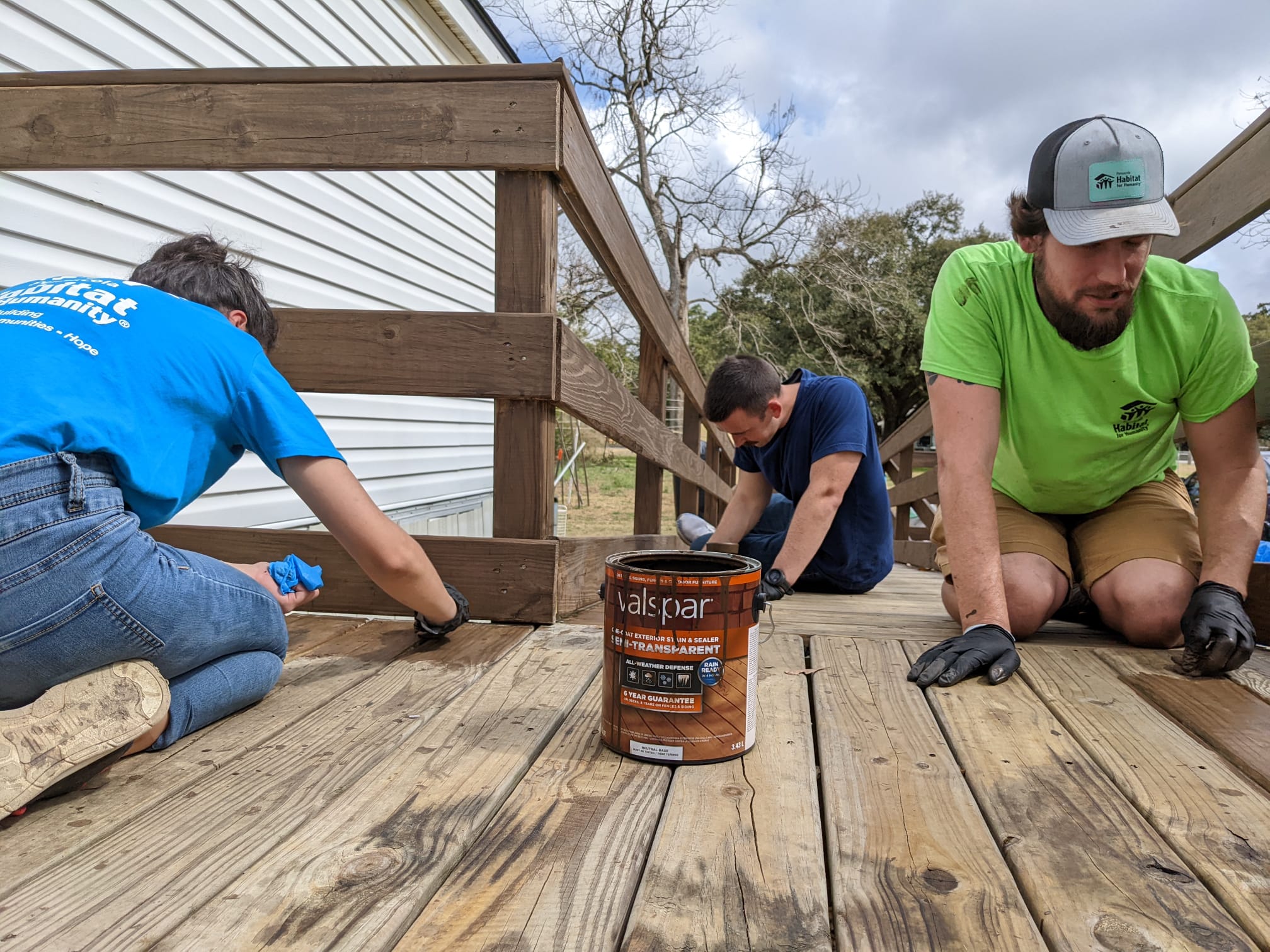 Volunteers Staining Wheelchair Ramp